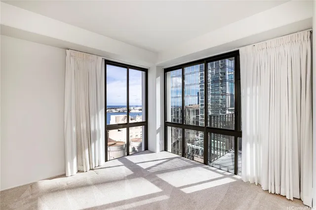 a bedroom with a large bed and a night stand