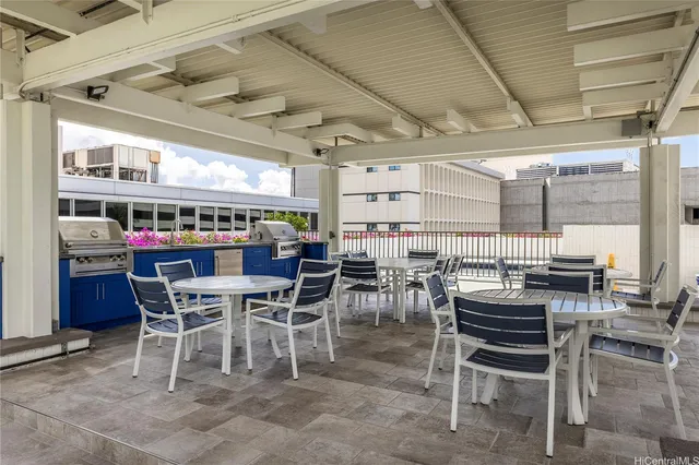 a view of a swimming pool with an outdoor seating