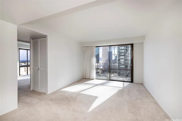 a view of an empty room with a window