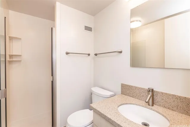 a bedroom with a large window and a balcony