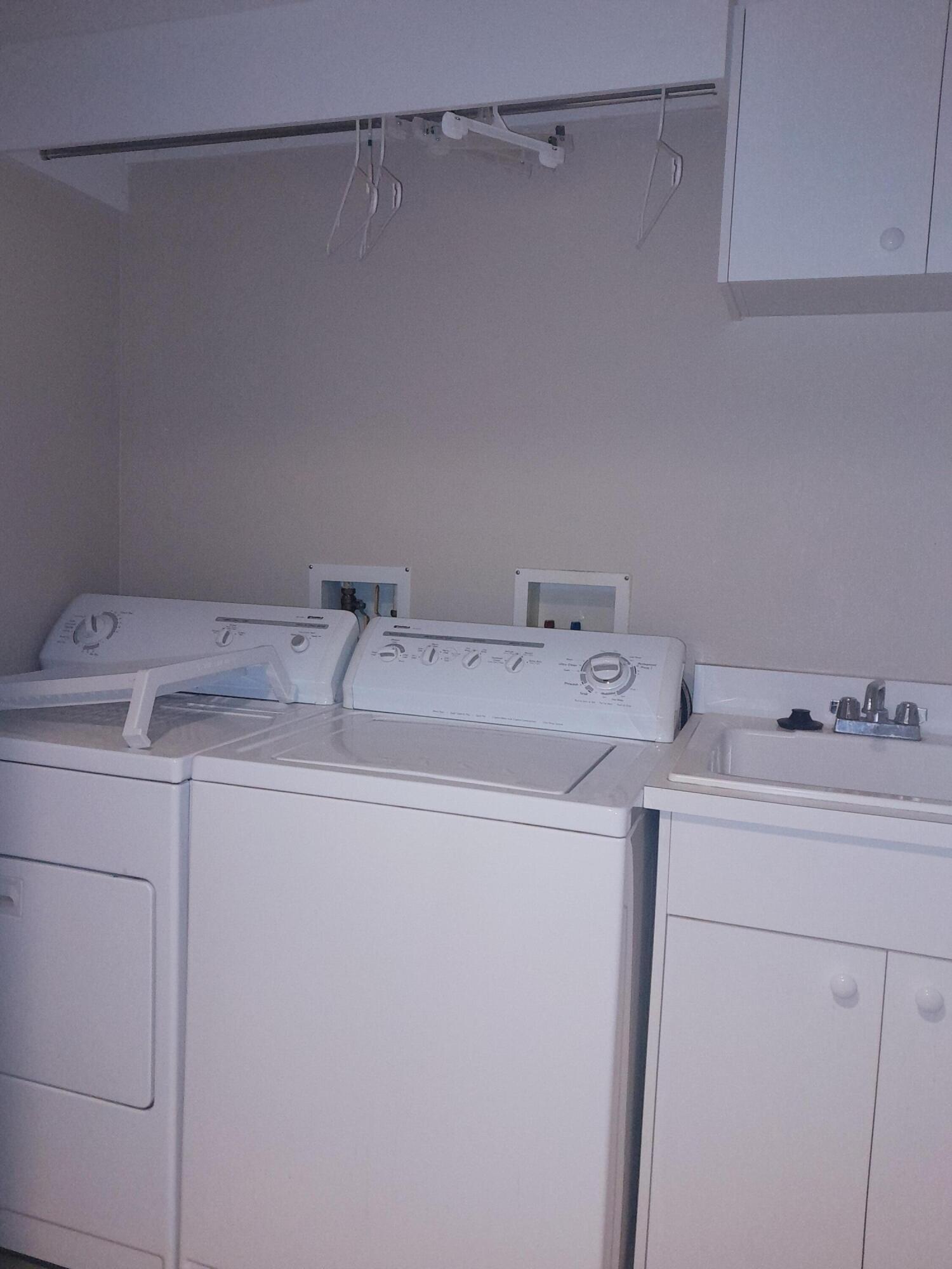 480 Sail Lane, Unit 302 Merritt Island, FL 32953 - Photo 11 of 21 a utility room with dryer and washer