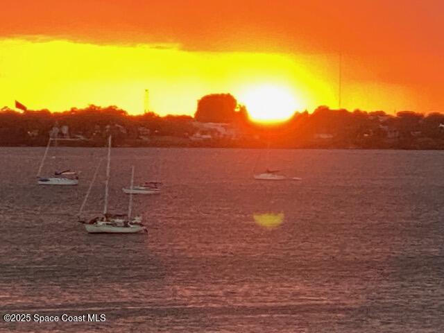 480 Sail Lane, Unit 302 Merritt Island, FL 32953 - Photo 20 of 21 a view of a lake with a mountain