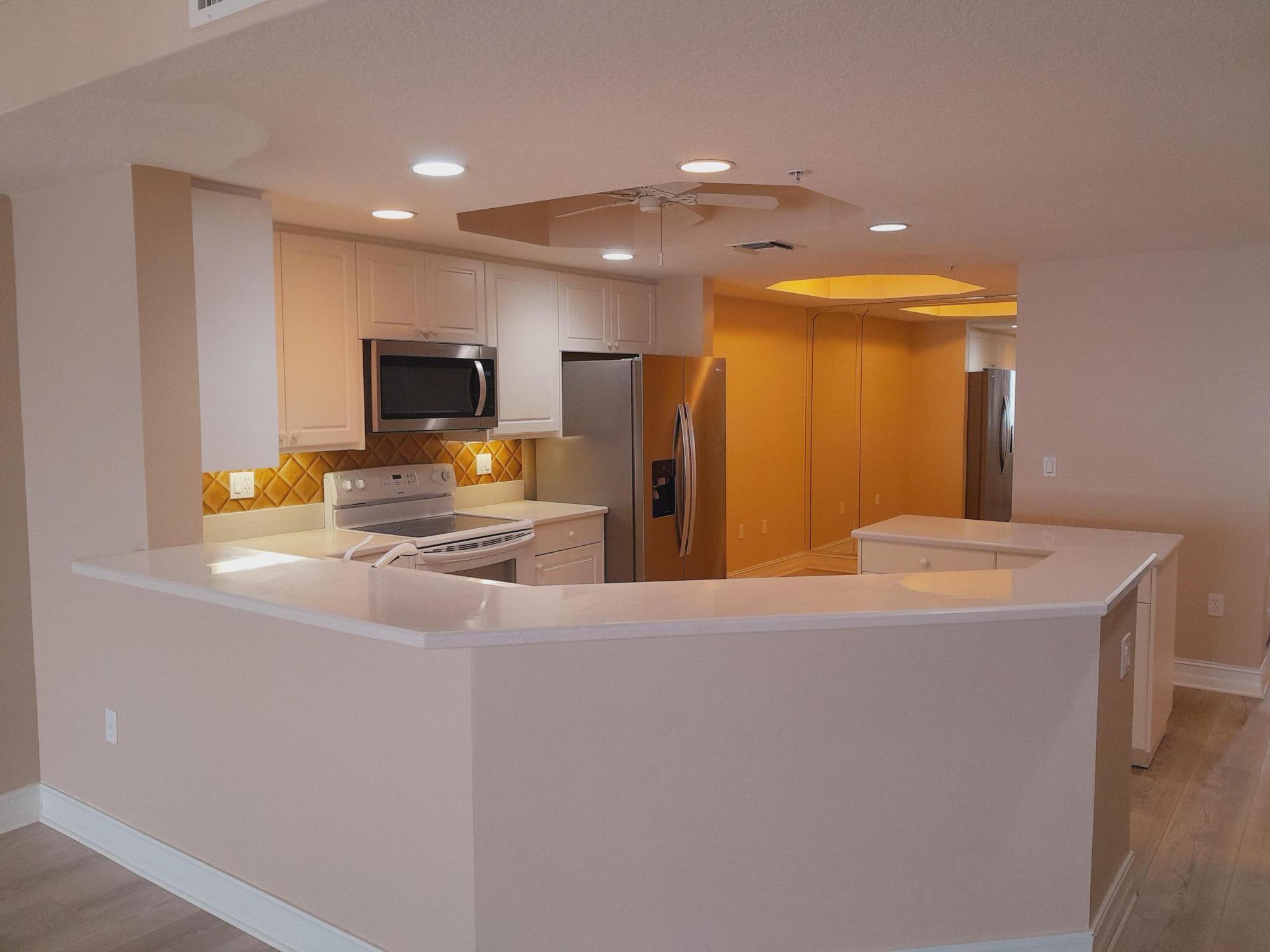 480 Sail Lane, Unit 302 Merritt Island, FL 32953 - Photo 4 of 21 a kitchen with stainless steel appliances a refrigerator and a stove