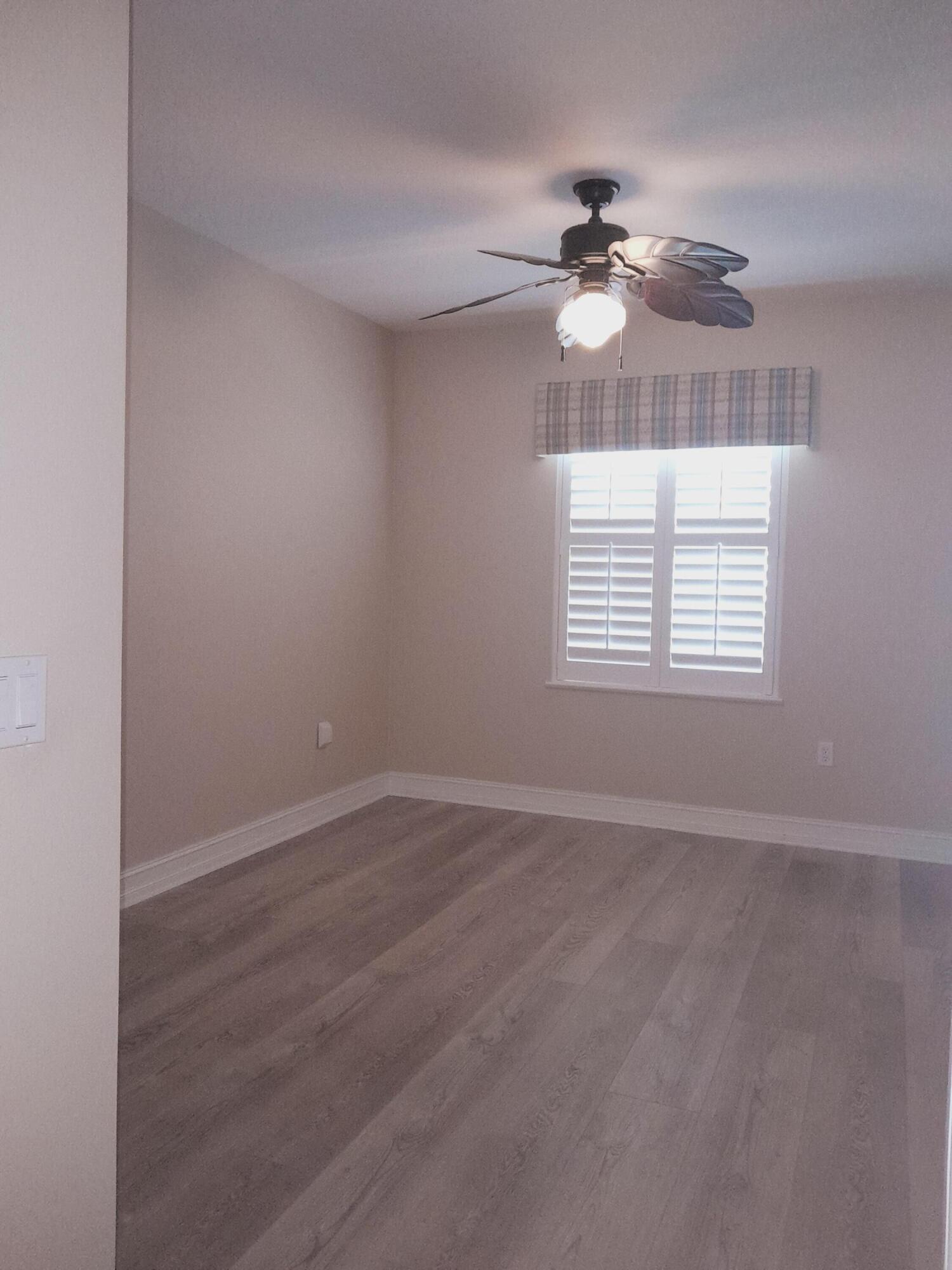 480 Sail Lane, Unit 302 Merritt Island, FL 32953 - Photo 8 of 21 a view of an empty room with a window