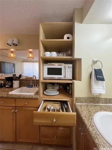 a kitchen with a stove and cabinets