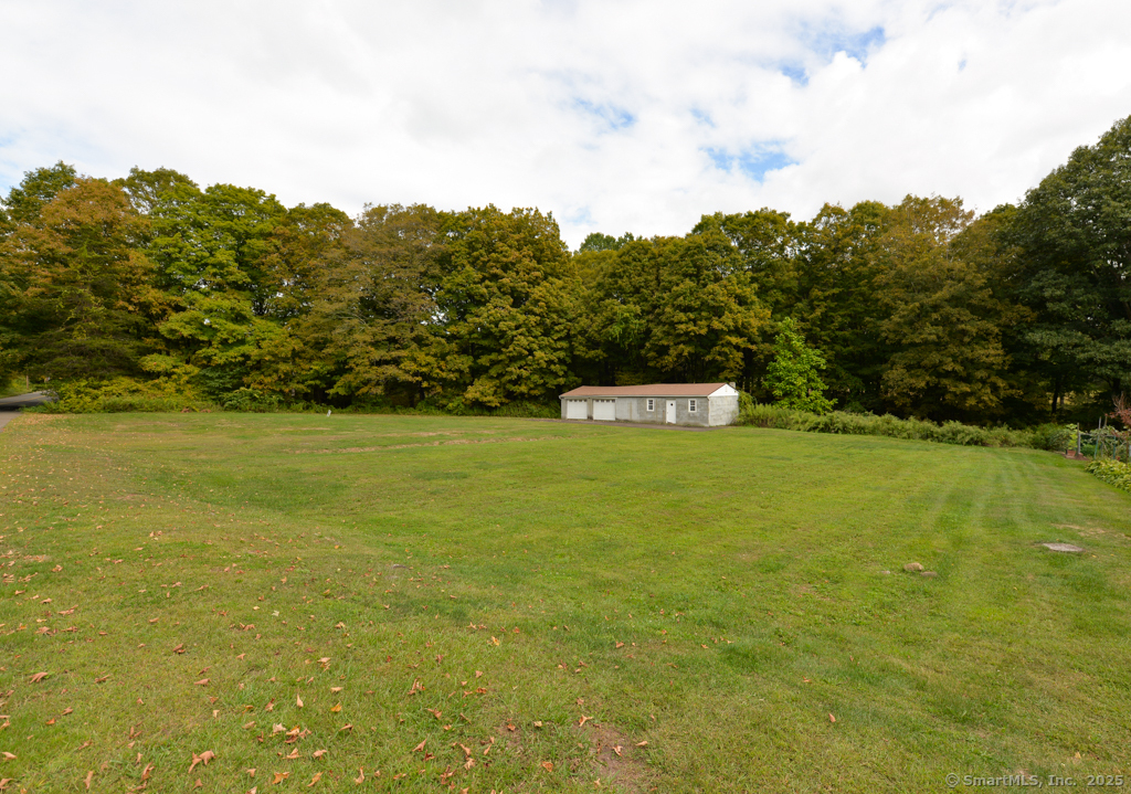 a view of a field with an outdoor space