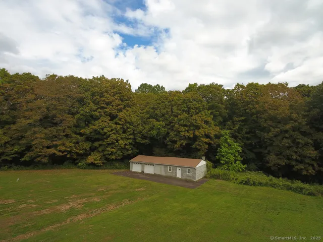a view of a large mountain with a mountain in the background