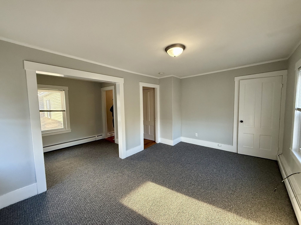 19 Ruggles Street, Unit 2 Westborough, MA 01581 - Photo 6 of 14 a view of an empty room with closet and a window