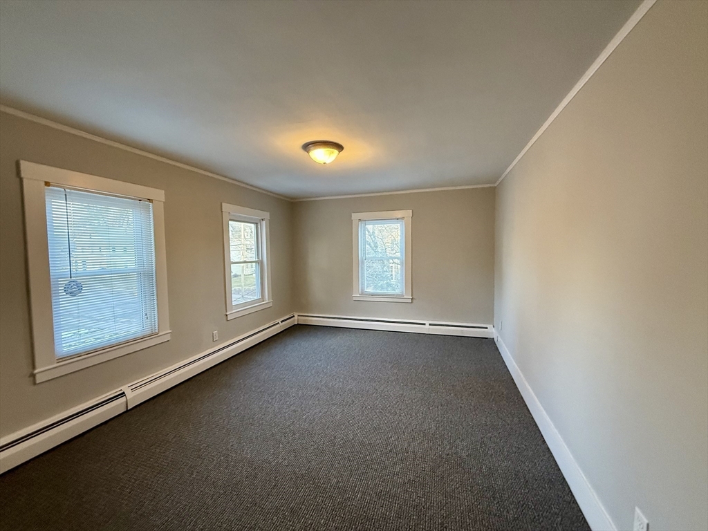 19 Ruggles Street, Unit 2 Westborough, MA 01581 - Photo 8 of 14 an empty room with windows