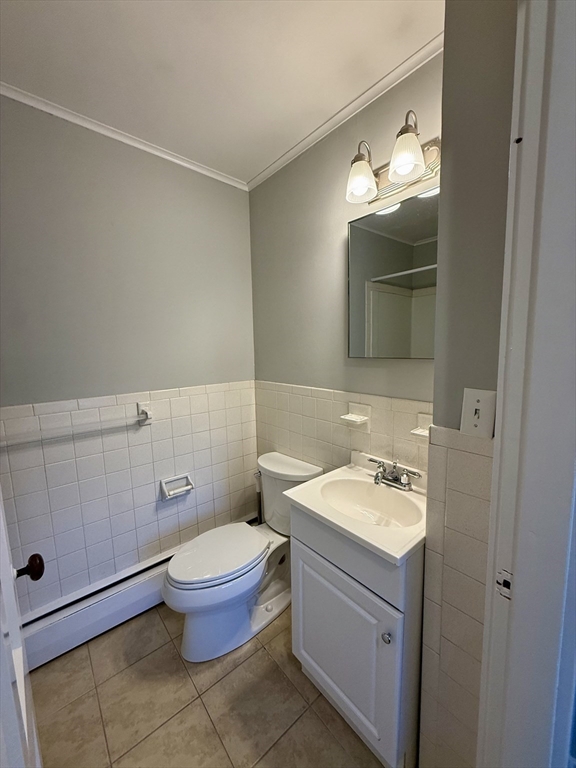 19 Ruggles Street, Unit 2 Westborough, MA 01581 - Photo 10 of 14 a bathroom with a toilet sink and mirror