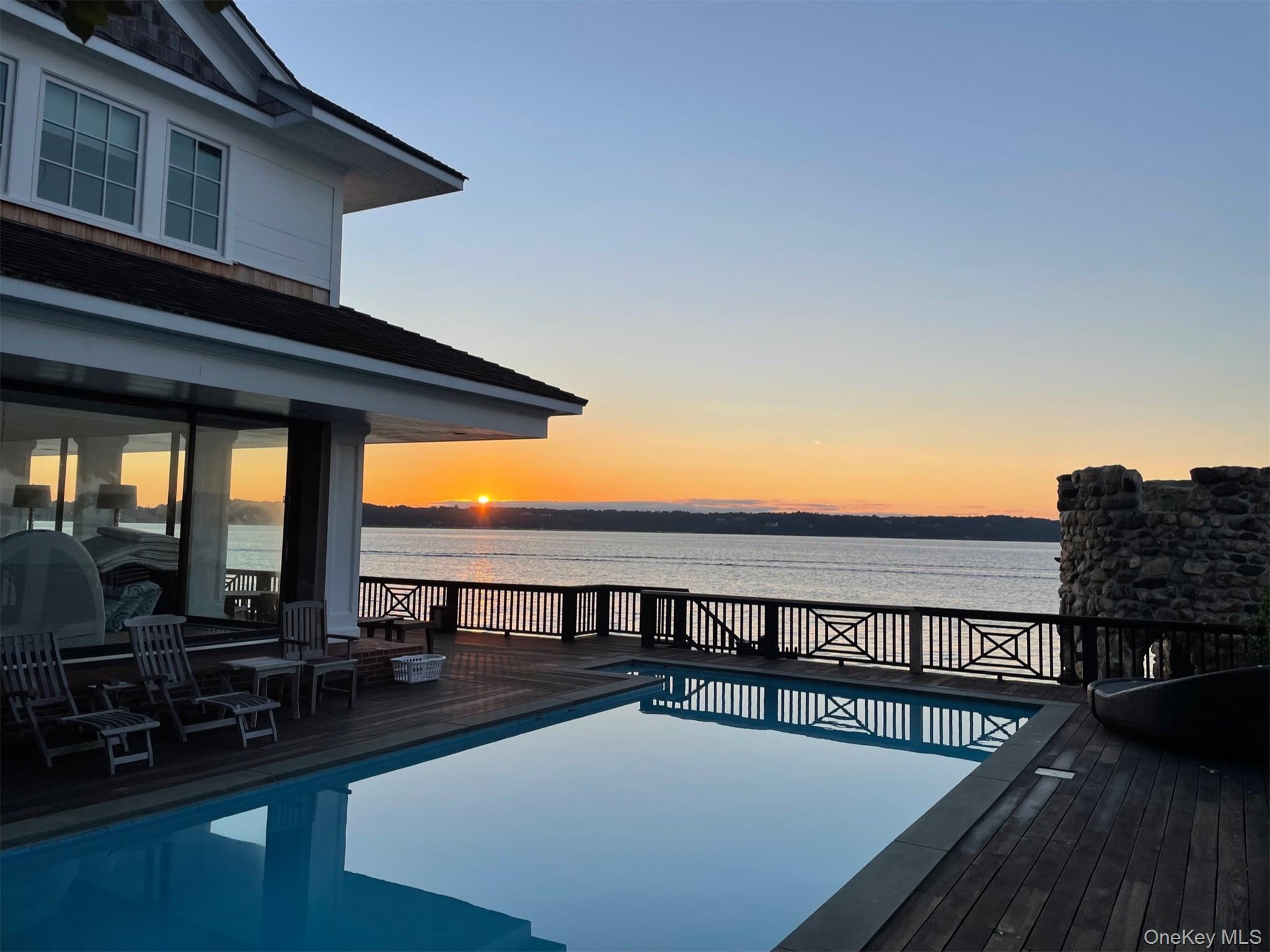 a view of swimming pool with furniture