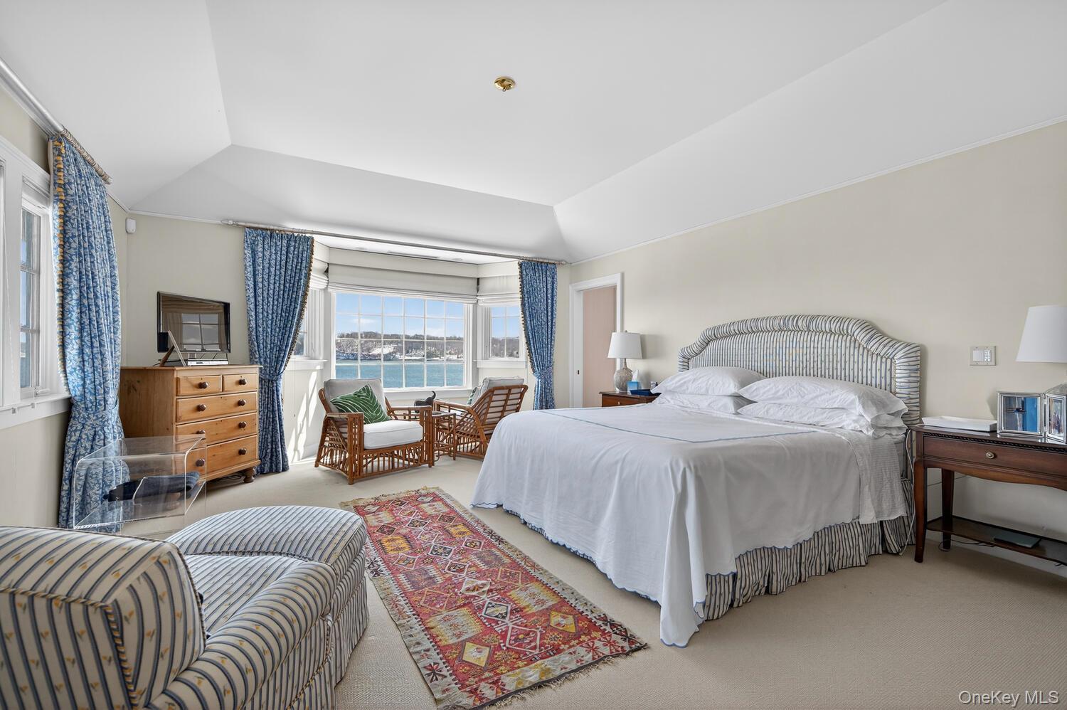 336 Centre Island Road Oyster Bay, NY 11771 - Photo 22 of 38 a bedroom with a bed and glass windows