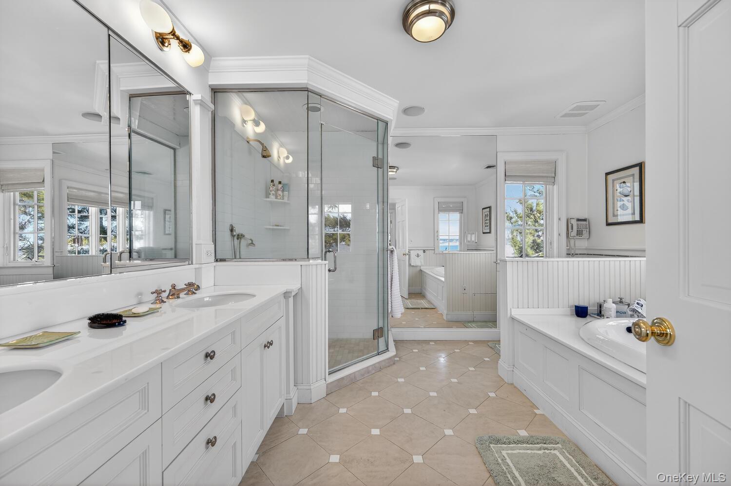 336 Centre Island Road Oyster Bay, NY 11771 - Photo 24 of 38 a spacious bathroom with a tub sink shower and mirror