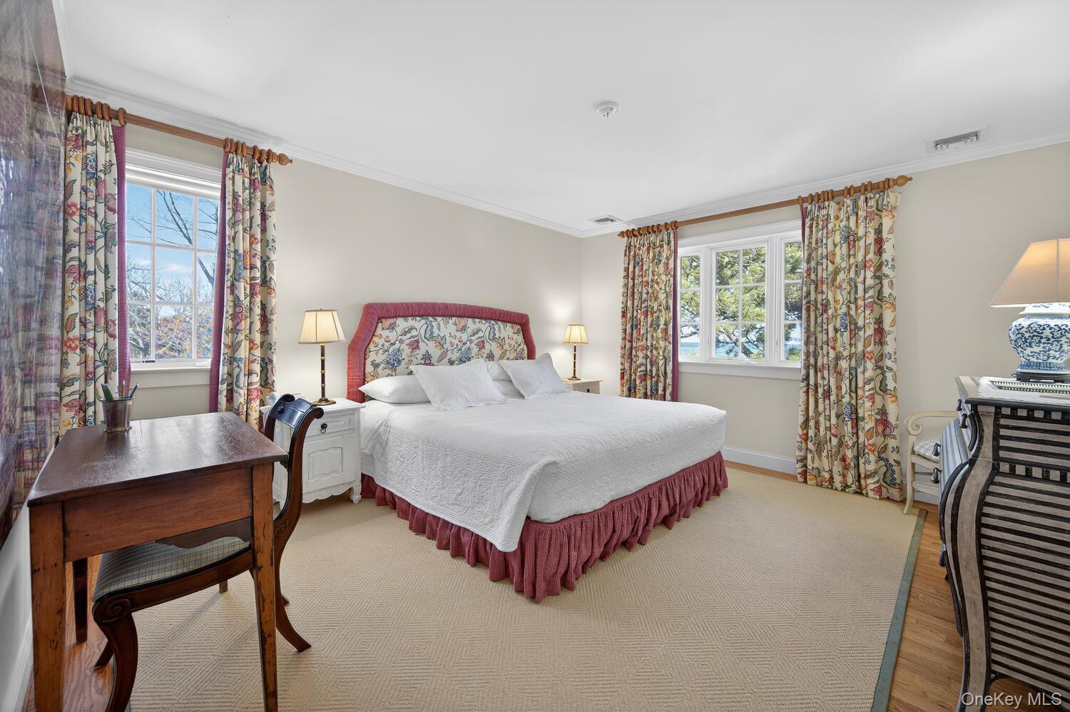 336 Centre Island Road Oyster Bay, NY 11771 - Photo 28 of 38 a bedroom with a bed and a table chair