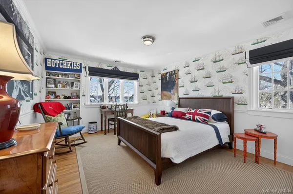 a bedroom with a bed and window