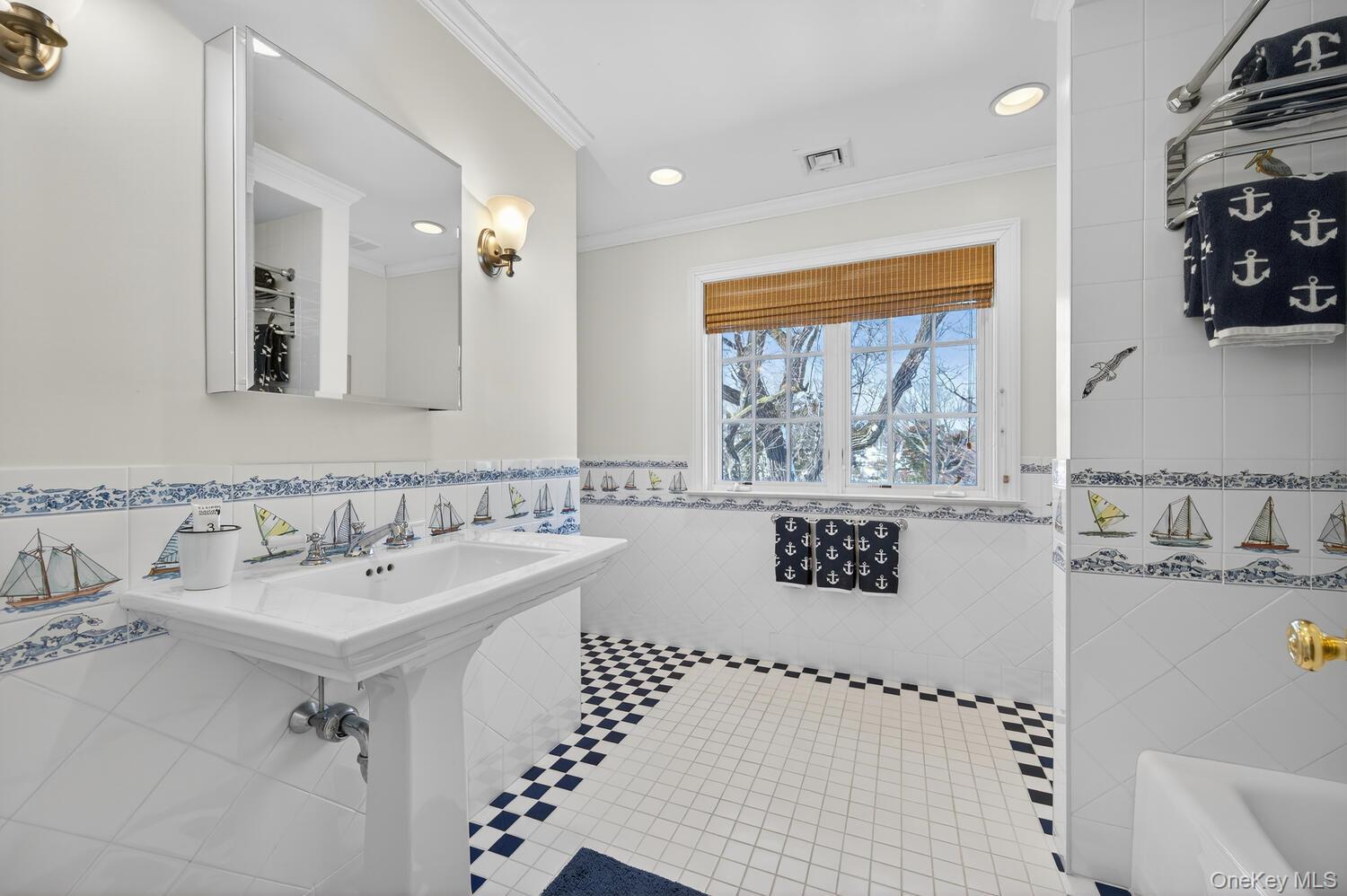 336 Centre Island Road Oyster Bay, NY 11771 - Photo 32 of 38 a bathroom with a sink a mirror and a shower