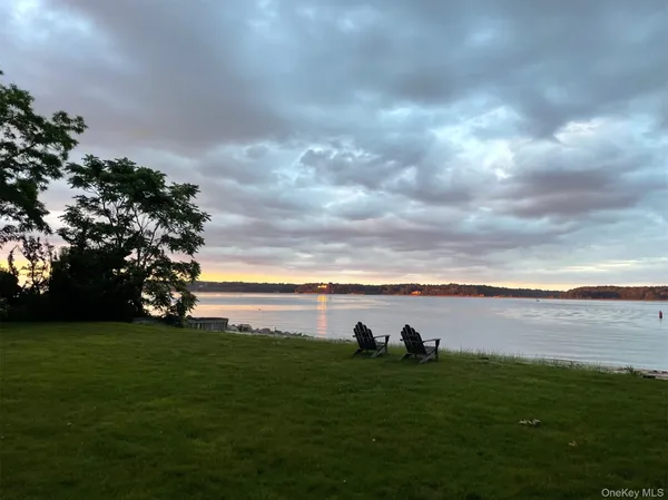 a view of an ocean and with a yard