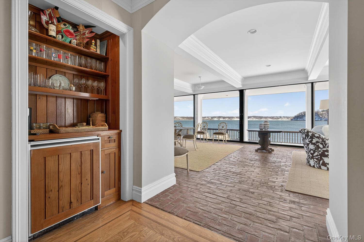 336 Centre Island Road Oyster Bay, NY 11771 - Photo 5 of 38 a hallway with hardwood floor and a large window