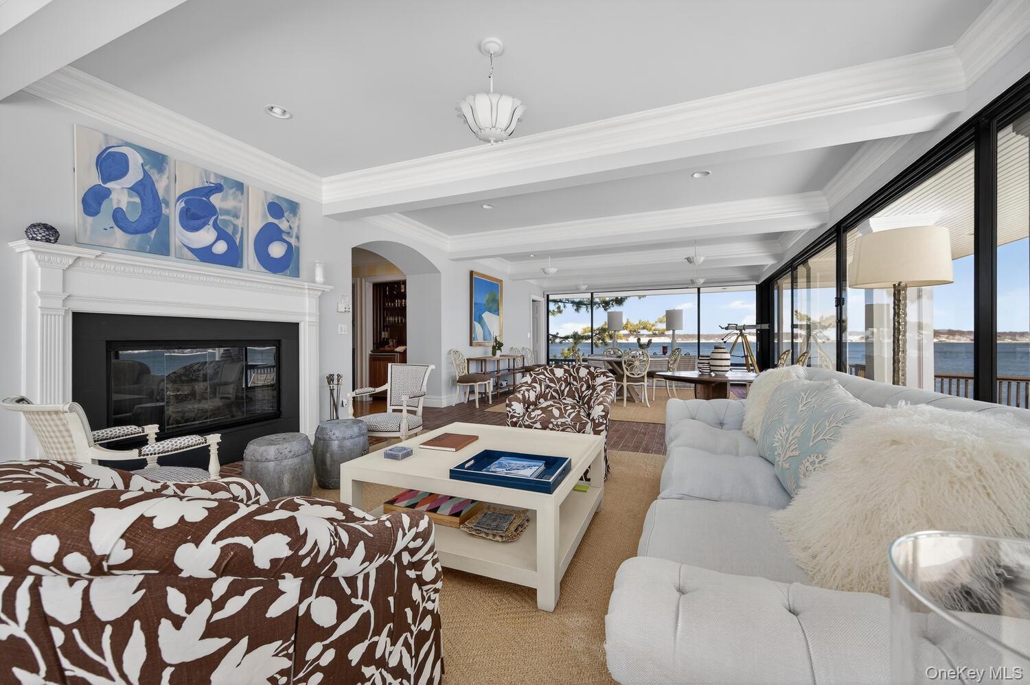 336 Centre Island Road Oyster Bay, NY 11771 - Photo 6 of 38 a living room with furniture large window and a fireplace