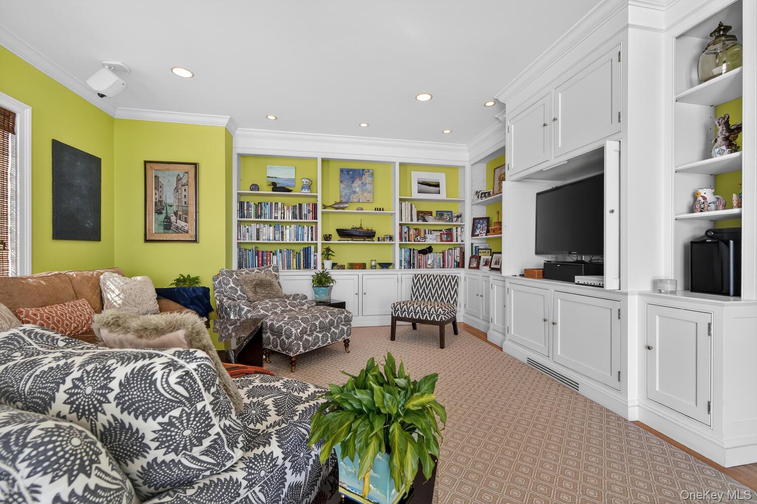 336 Centre Island Road Oyster Bay, NY 11771 - Photo 10 of 38 a bedroom with furniture and a flat screen tv