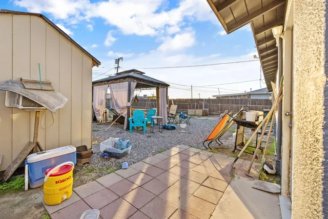 a view of a swimming pool with a patio