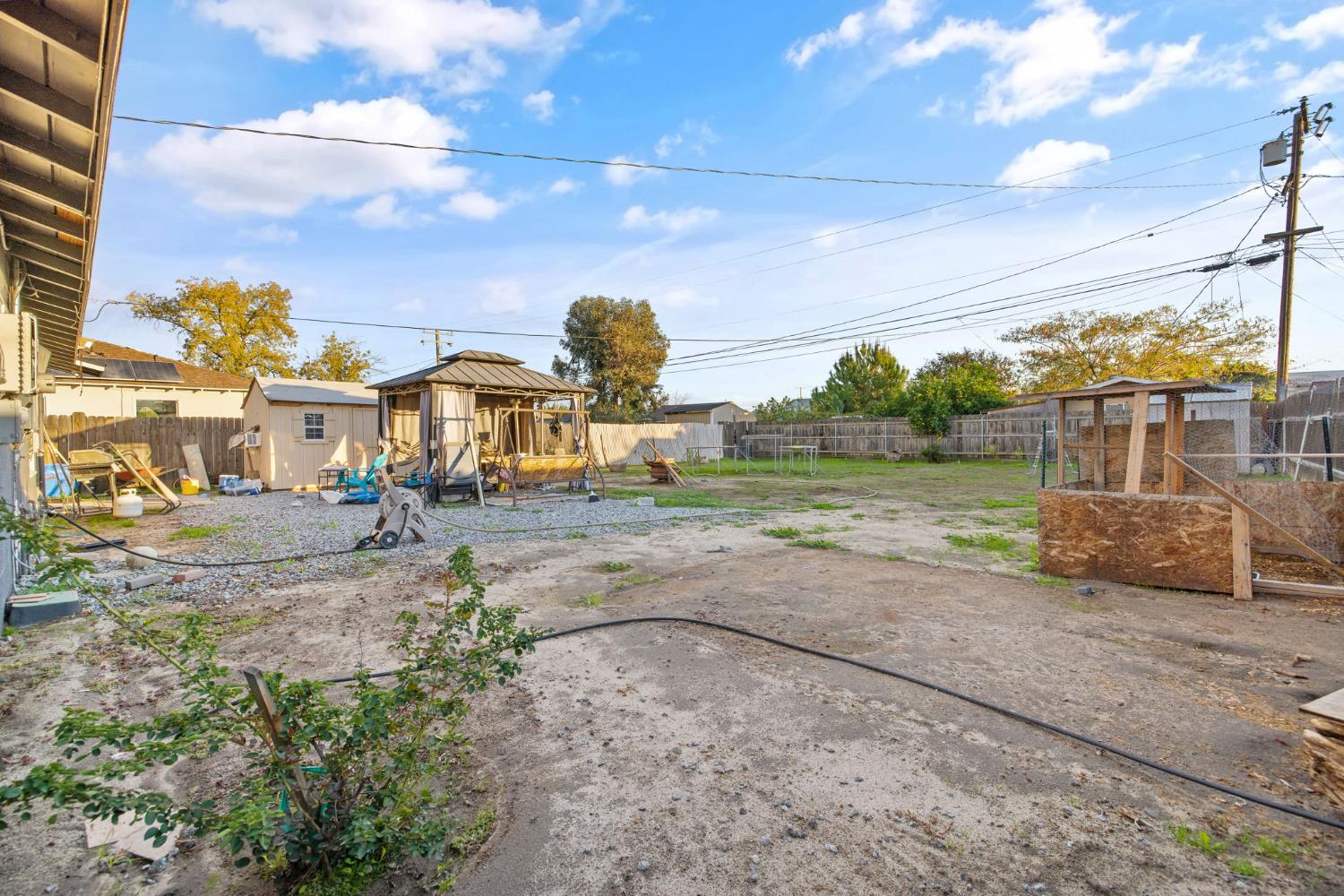 821 Lincoln Street Hanford, CA 93230 - Photo 17 of 22 a view of a yard with of car parked