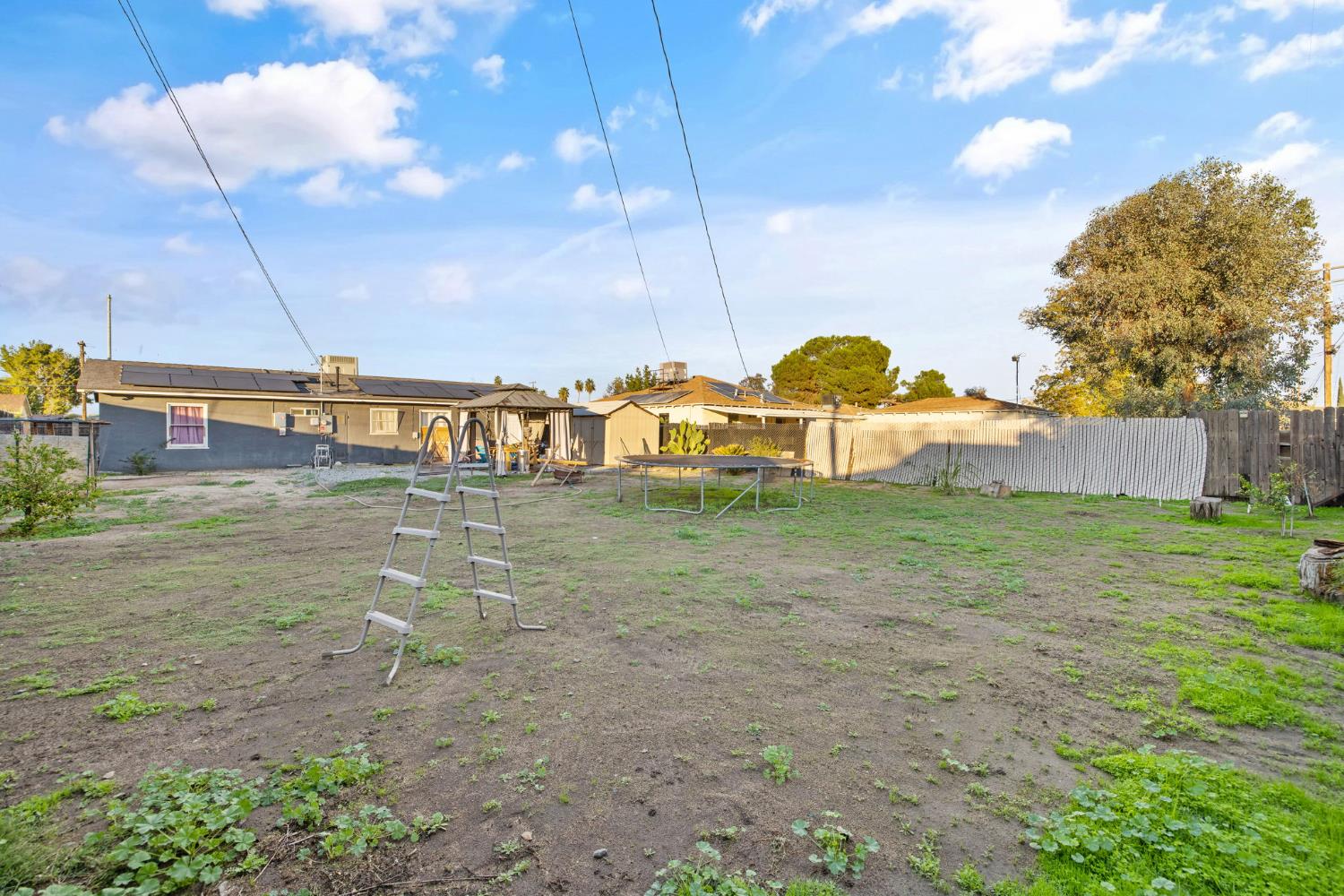 821 Lincoln Street Hanford, CA 93230 - Photo 19 of 22 a view of a house with a yard