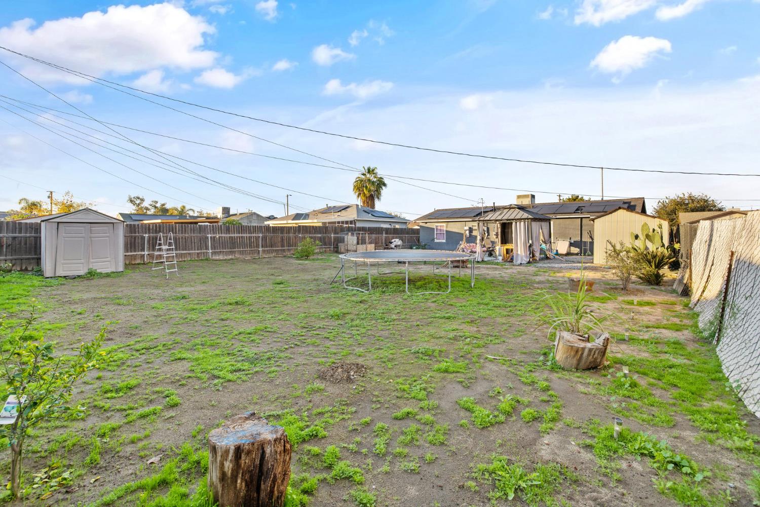 821 Lincoln Street Hanford, CA 93230 - Photo 20 of 22 a backyard of a house with table and chairs