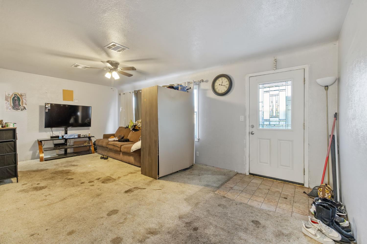 821 Lincoln Street Hanford, CA 93230 - Photo 4 of 22 a view of a livingroom with furniture and a flat screen tv