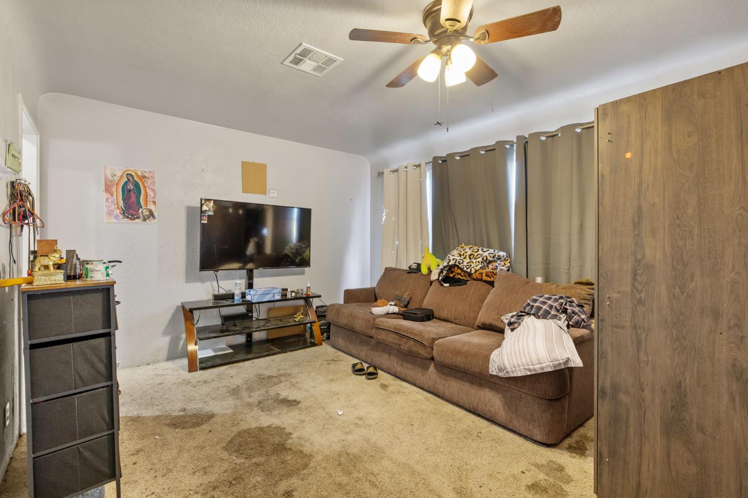 821 Lincoln Street Hanford, CA 93230 - Photo 5 of 22 a living room with furniture and a flat screen tv