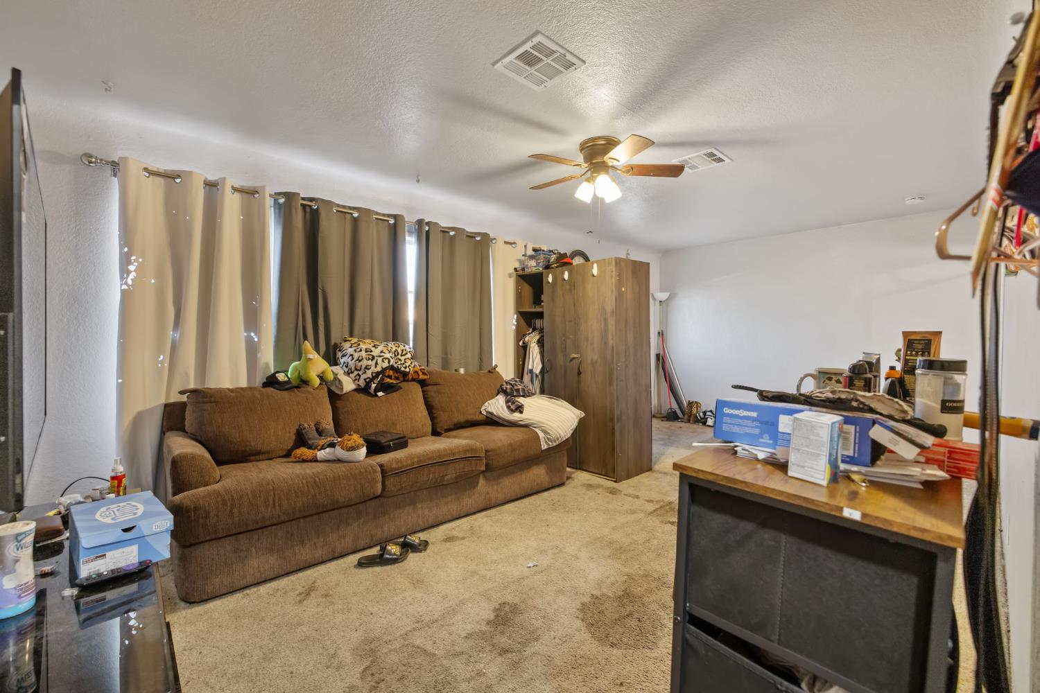 821 Lincoln Street Hanford, CA 93230 - Photo 6 of 22 a living room with furniture and a flat screen tv