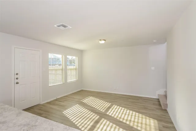 a view of an empty room and window