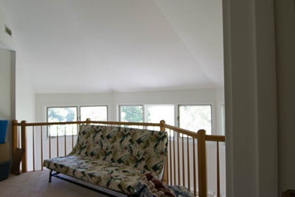 84 Jasper Lane, Unit 84 Randolph, MA 02368 - Photo 7 of 11 a living room with furniture and a floor to ceiling window
