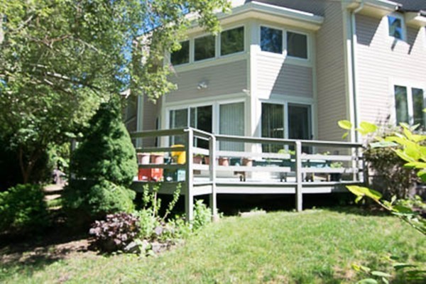 84 Jasper Lane, Unit 84 Randolph, MA 02368 - Photo 8 of 11 a house view with a garden space