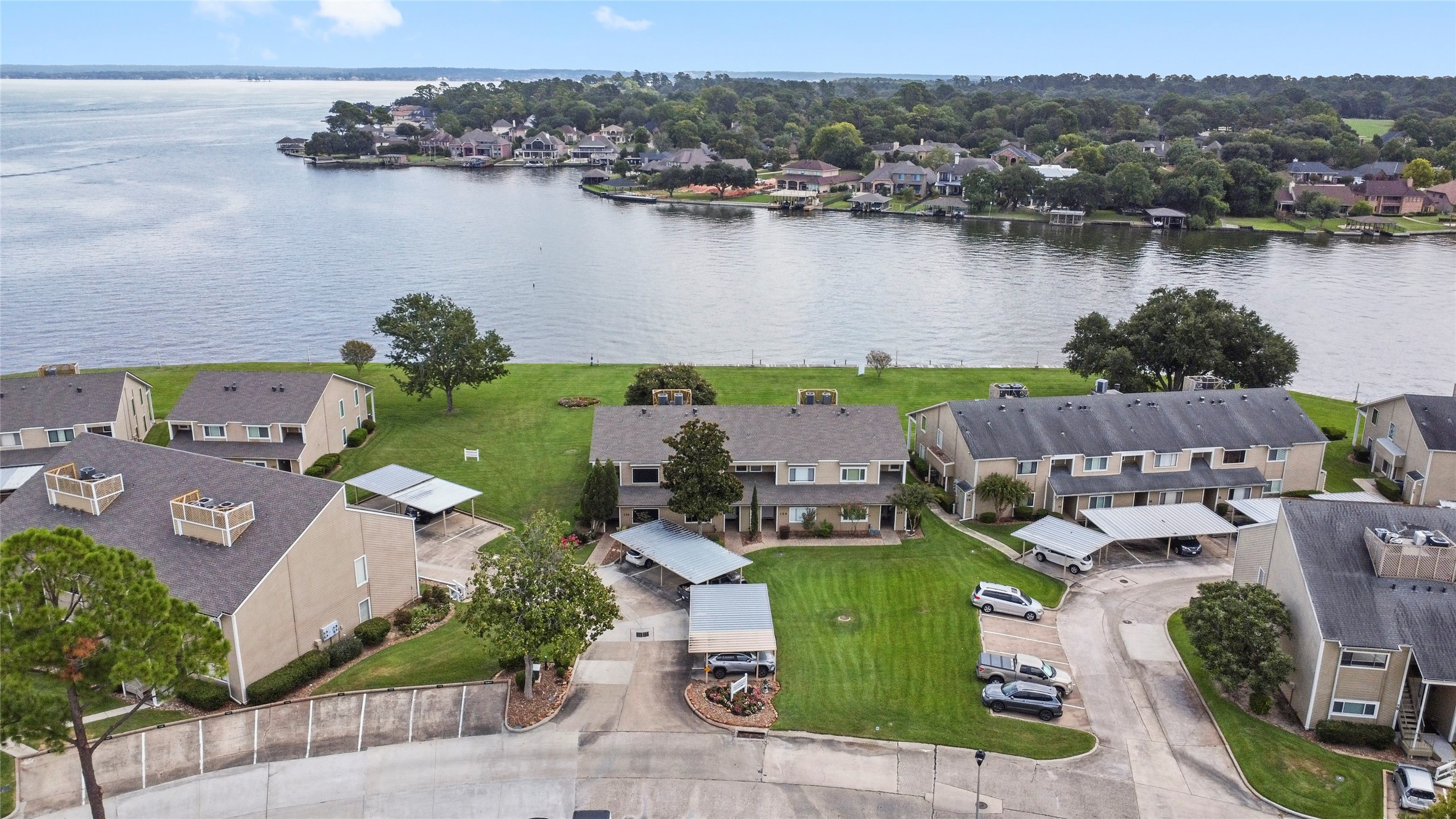 135 April Point Drive South Conroe, TX 77356 - Photo 36 of 46 an aerial view of a house with a lake view