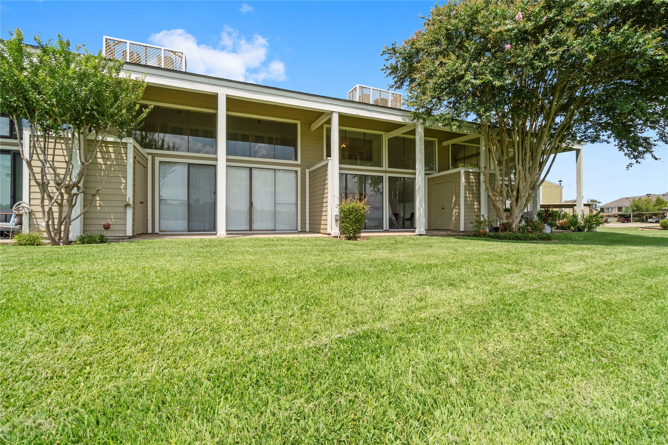 135 April Point Drive South Conroe, TX 77356 - Photo 42 of 46 a front view of a house with a yard