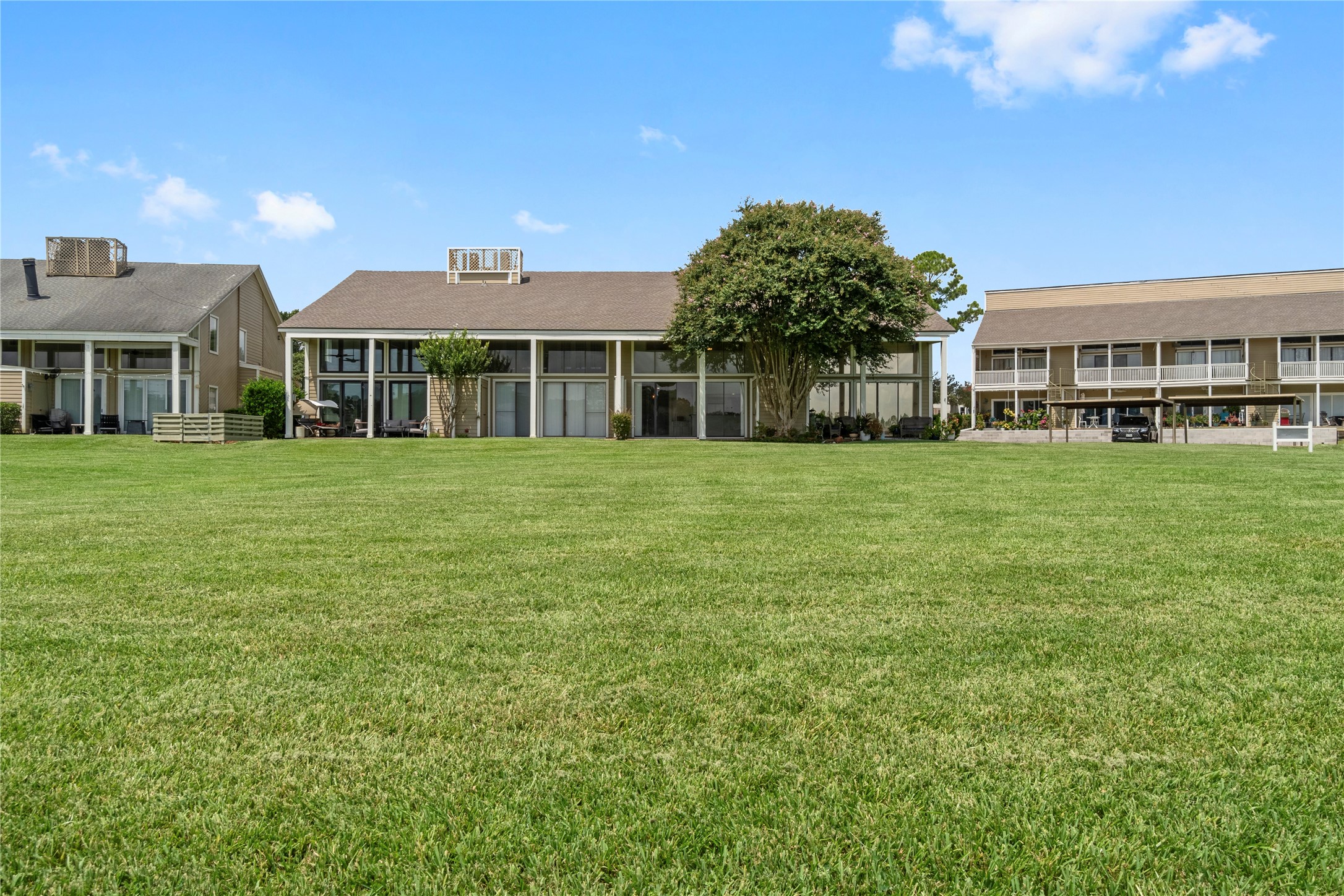 135 April Point Drive South Conroe, TX 77356 - Photo 45 of 46 a front view of a building with a garden