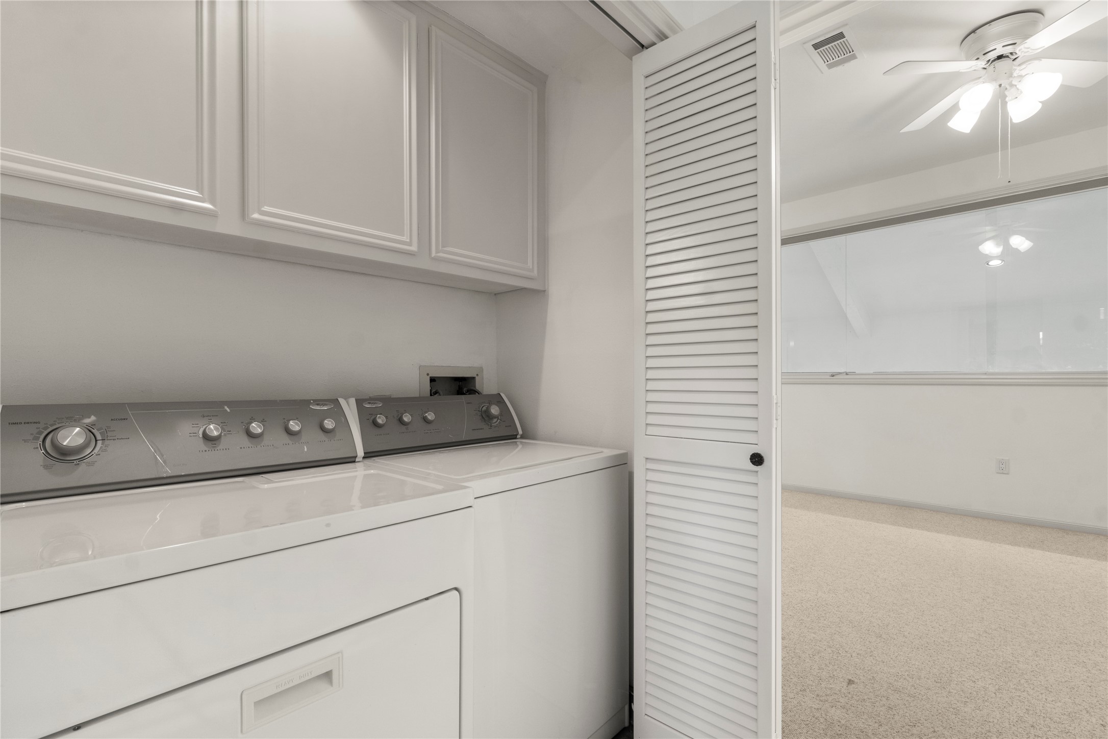 135 April Point Drive South Conroe, TX 77356 - Photo 5 of 46 a view of storage and utility room with washer and dryer