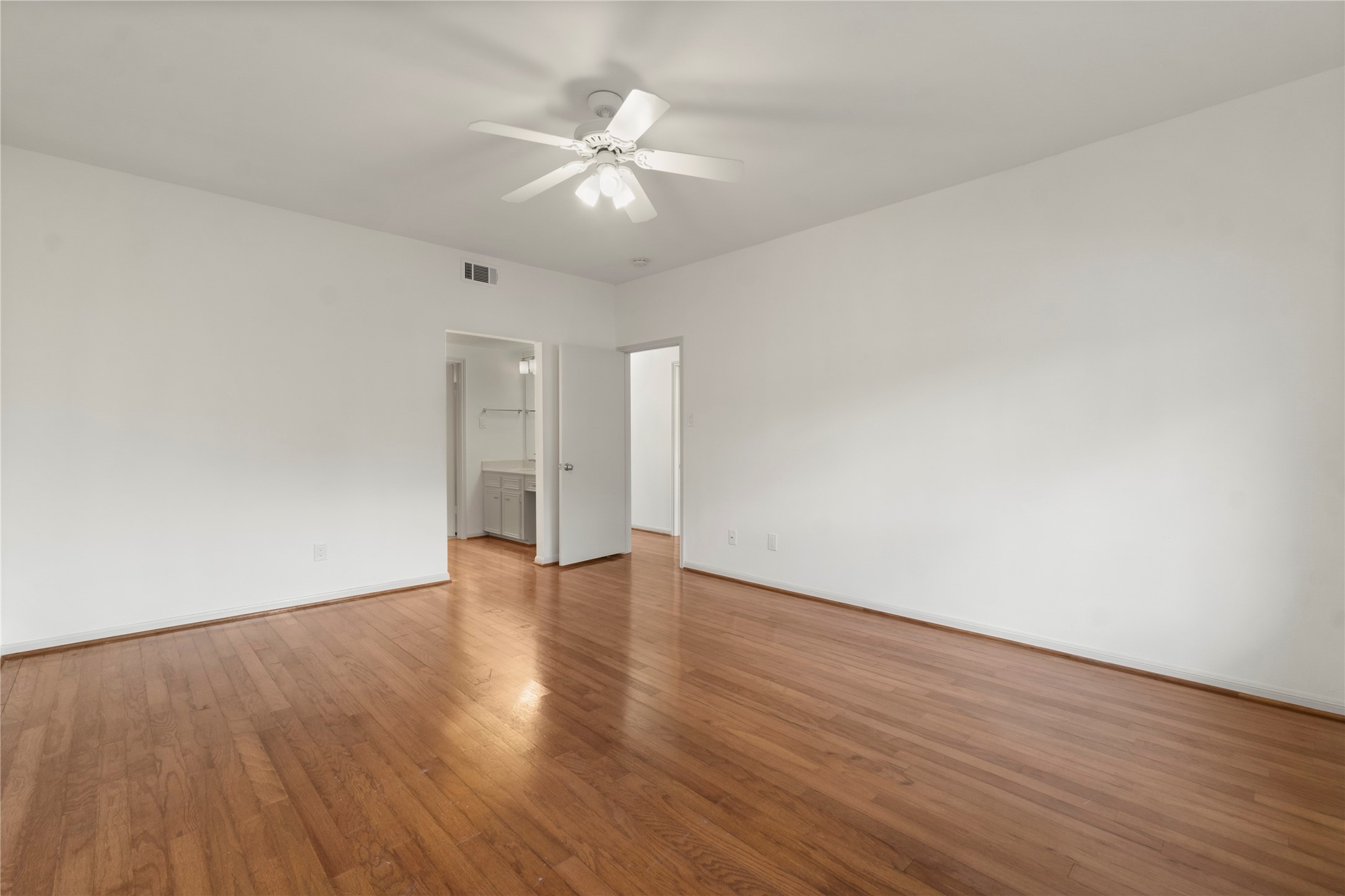 135 April Point Drive South Conroe, TX 77356 - Photo 7 of 46 a view of an empty room with wooden floor