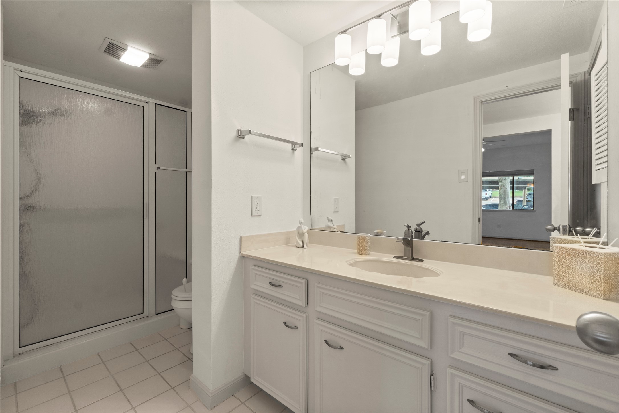 135 April Point Drive South Conroe, TX 77356 - Photo 9 of 46 a bathroom with a double vanity sink mirror and shower