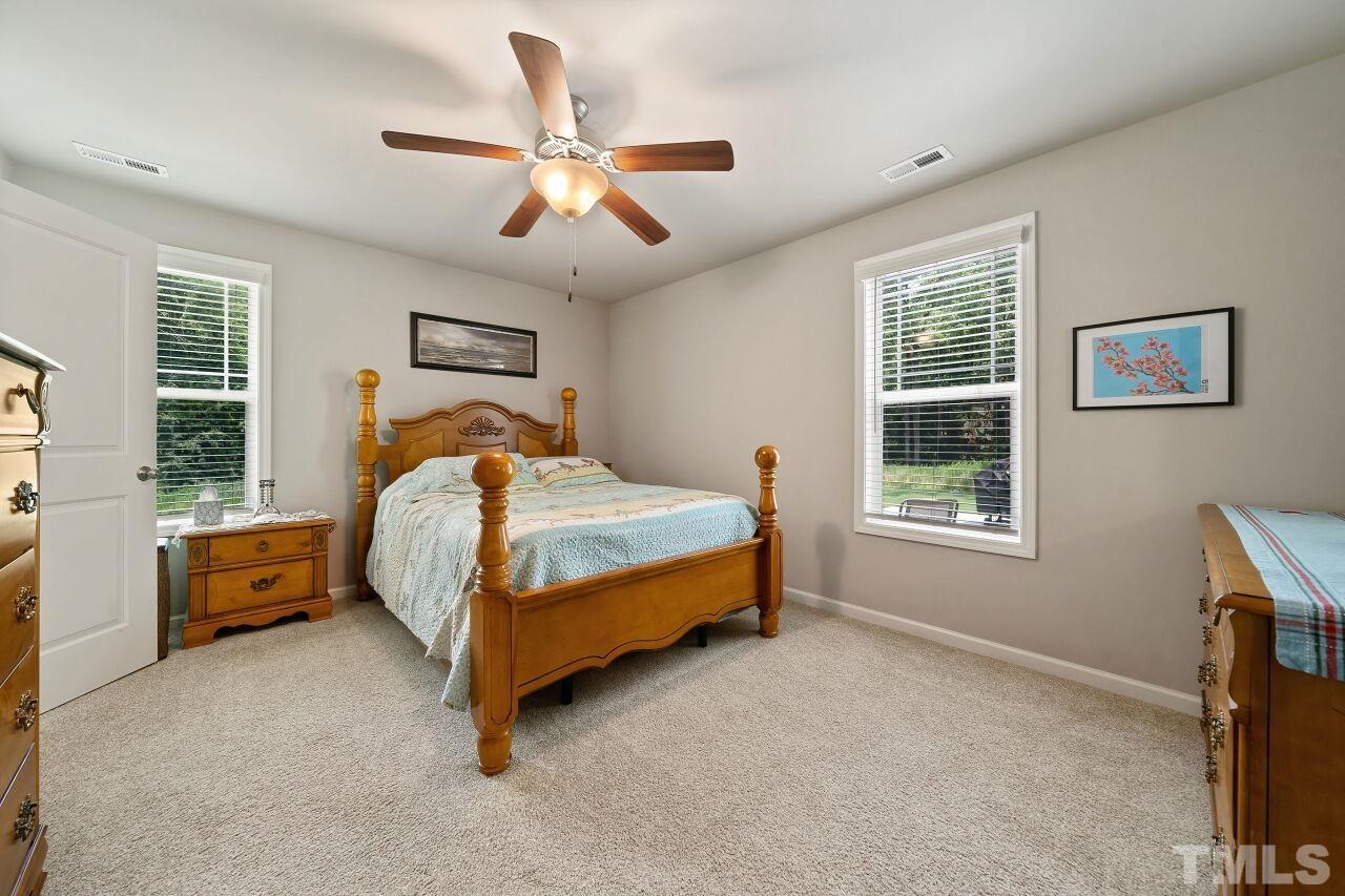 169 Willow Ridge Circle Willow Spring, NC 27592 - Photo 18 of 30 a bedroom with a bed and window