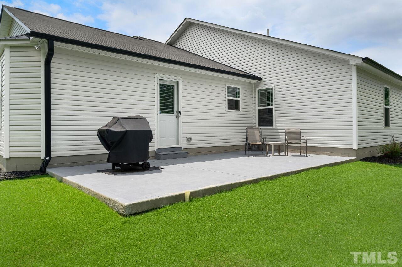 169 Willow Ridge Circle Willow Spring, NC 27592 - Photo 27 of 30 a view of backyard of house with seating