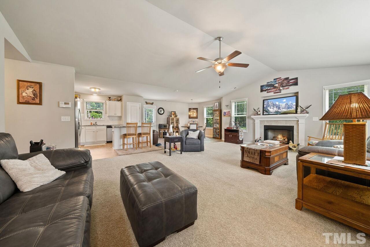169 Willow Ridge Circle Willow Spring, NC 27592 - Photo 7 of 30 a living room with furniture fireplace and window