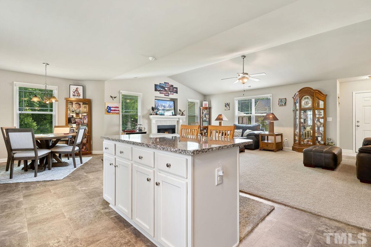 169 Willow Ridge Circle Willow Spring, NC 27592 - Photo 10 of 30 a view of living room kitchen with furniture and windows