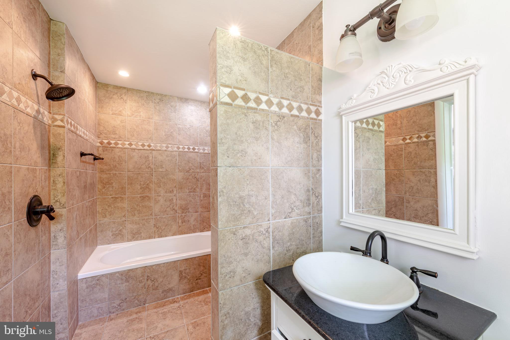 8221 West Beach Terrace Northwest Washington, DC 20012 - Photo 11 of 23 Primary bath with tub and shower