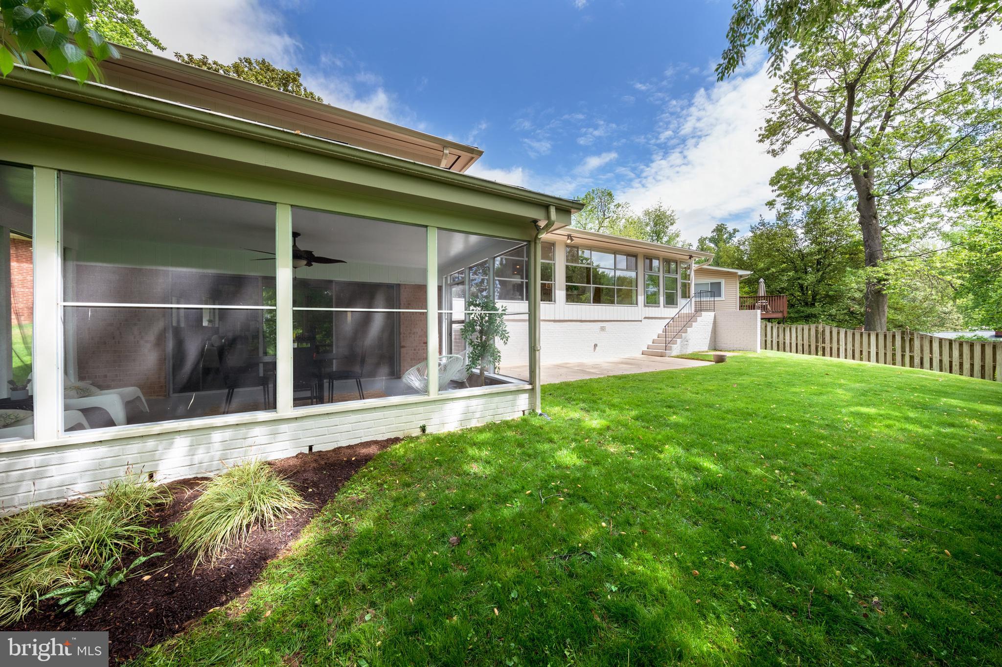 8221 West Beach Terrace Northwest Washington, DC 20012 - Photo 20 of 23 Rear yard and screened porch