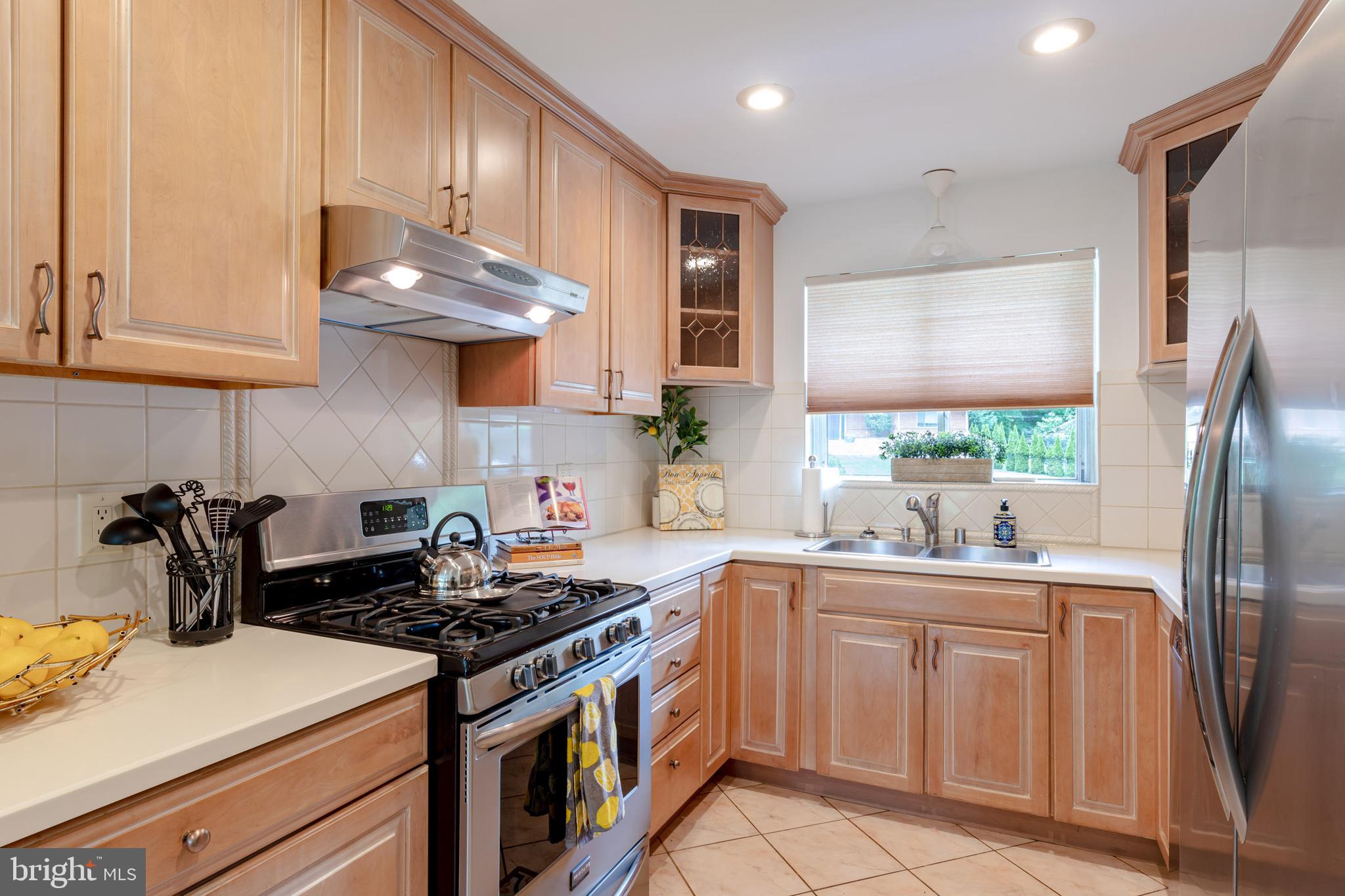 8221 West Beach Terrace Northwest Washington, DC 20012 - Photo 7 of 23 Solid surface counters and stainless appliances