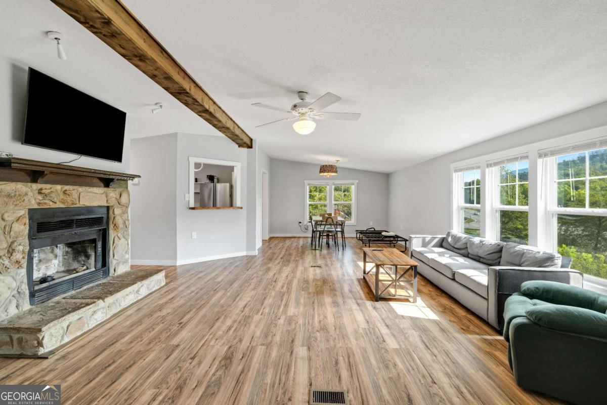 1330 Old Northcutt Road Ellijay, GA 30540 - Photo 2 of 21 a living room with furniture fireplace and flat screen tv