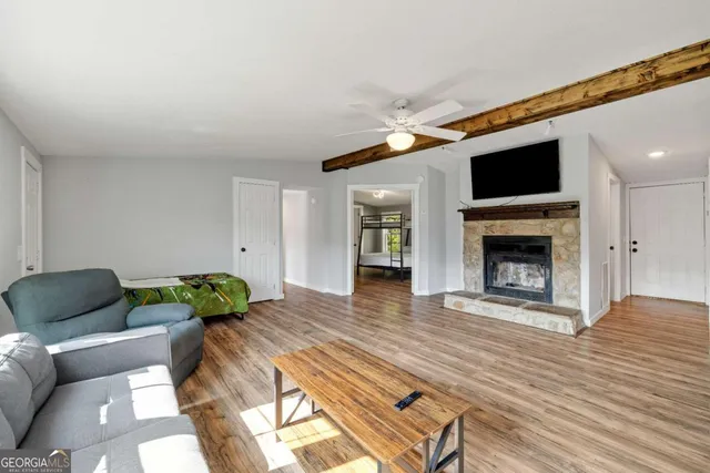a living room with furniture and a fireplace