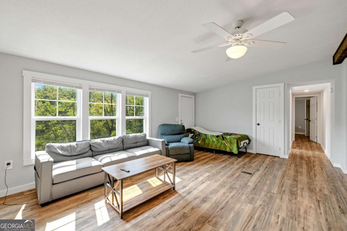 1330 Old Northcutt Road Ellijay, GA 30540 - Photo 7 of 21 a living room with furniture and a large window
